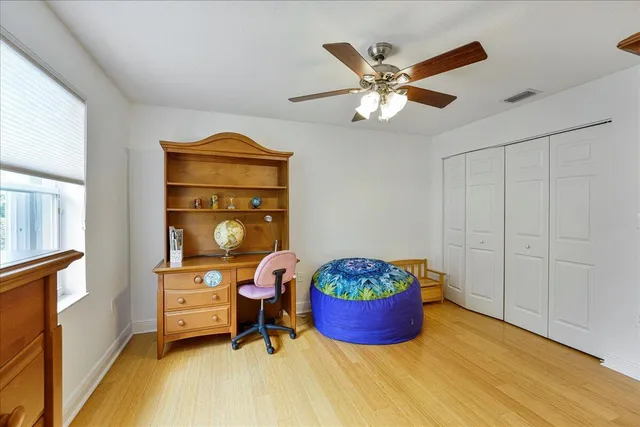 a bed room with a bed and a window