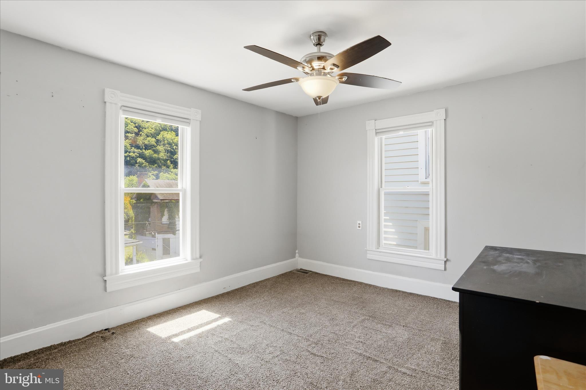 21 Sharpless Street Keyser, WV 26726 - Photo 24 of 33 an empty room with windows and fan