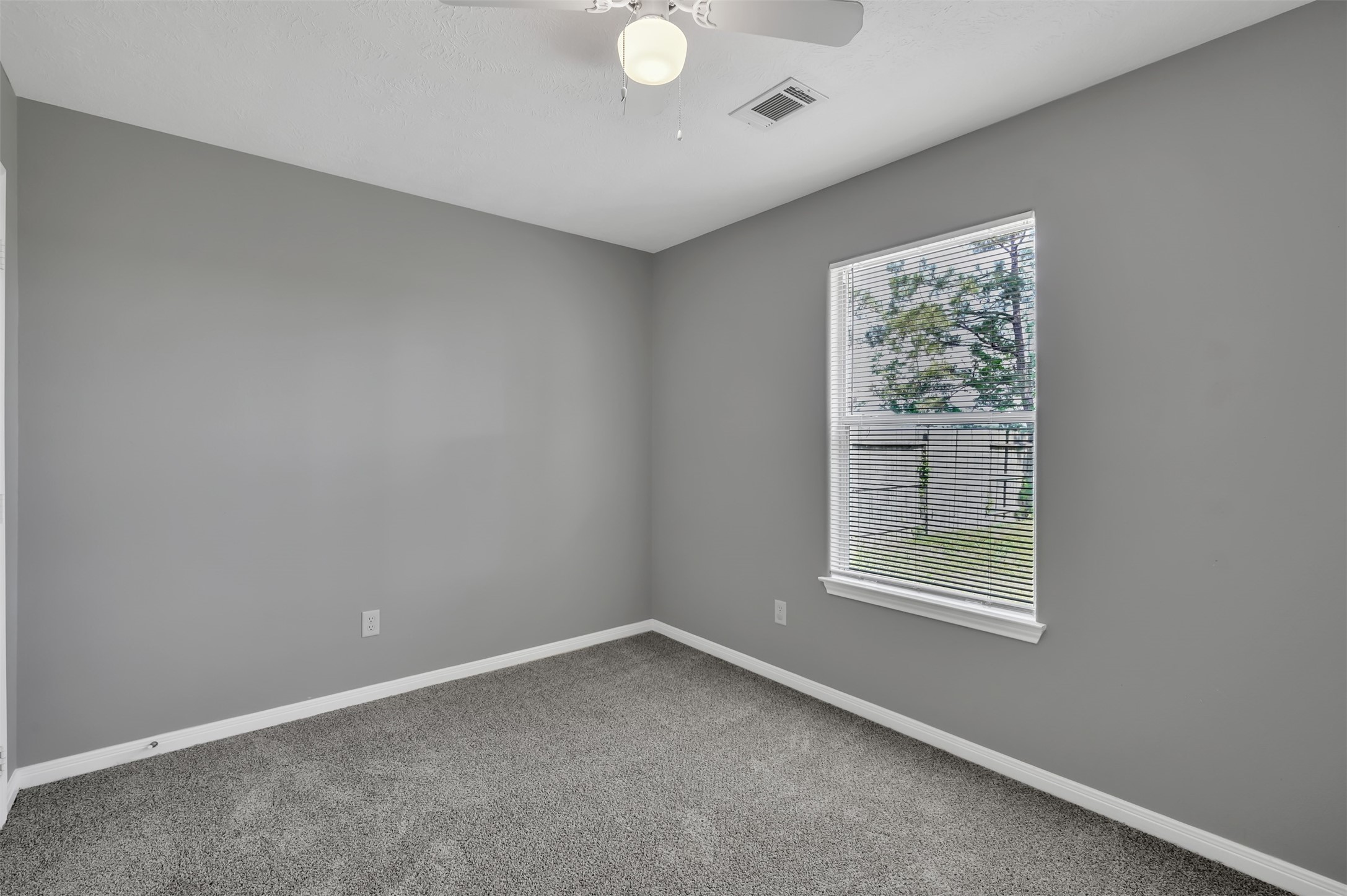 16245 Sun View Lane Conroe, TX 77302 - Photo 12 of 19 an empty room with a window