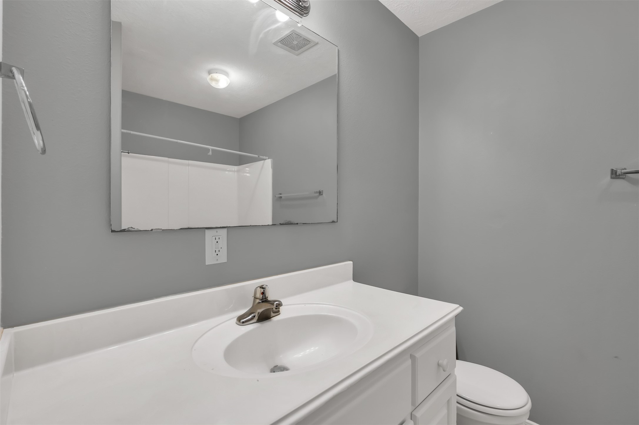 16245 Sun View Lane Conroe, TX 77302 - Photo 15 of 19 a bathroom with a sink a toilet and mirror