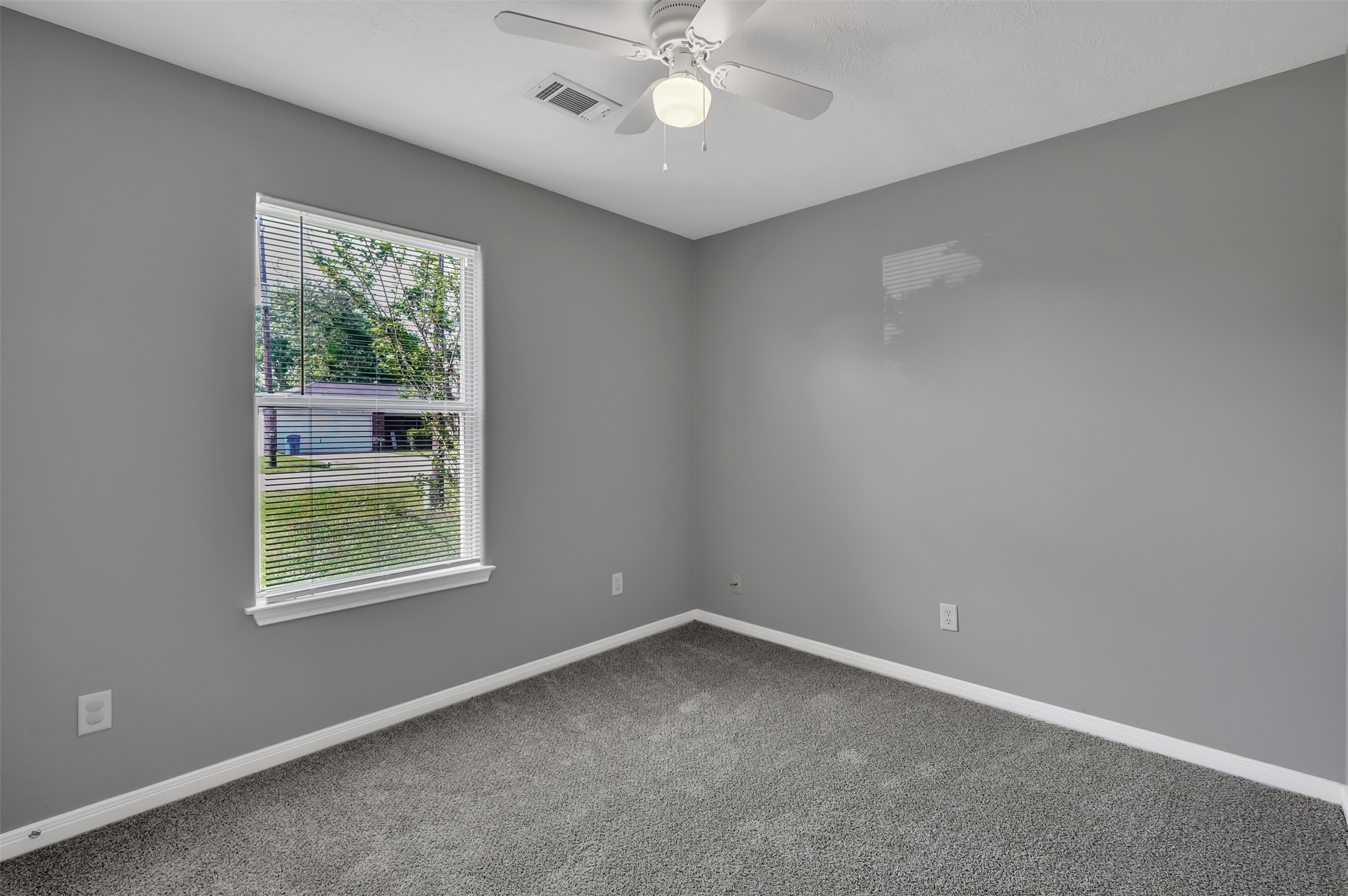 16245 Sun View Lane Conroe, TX 77302 - Photo 16 of 19 an empty room with a window