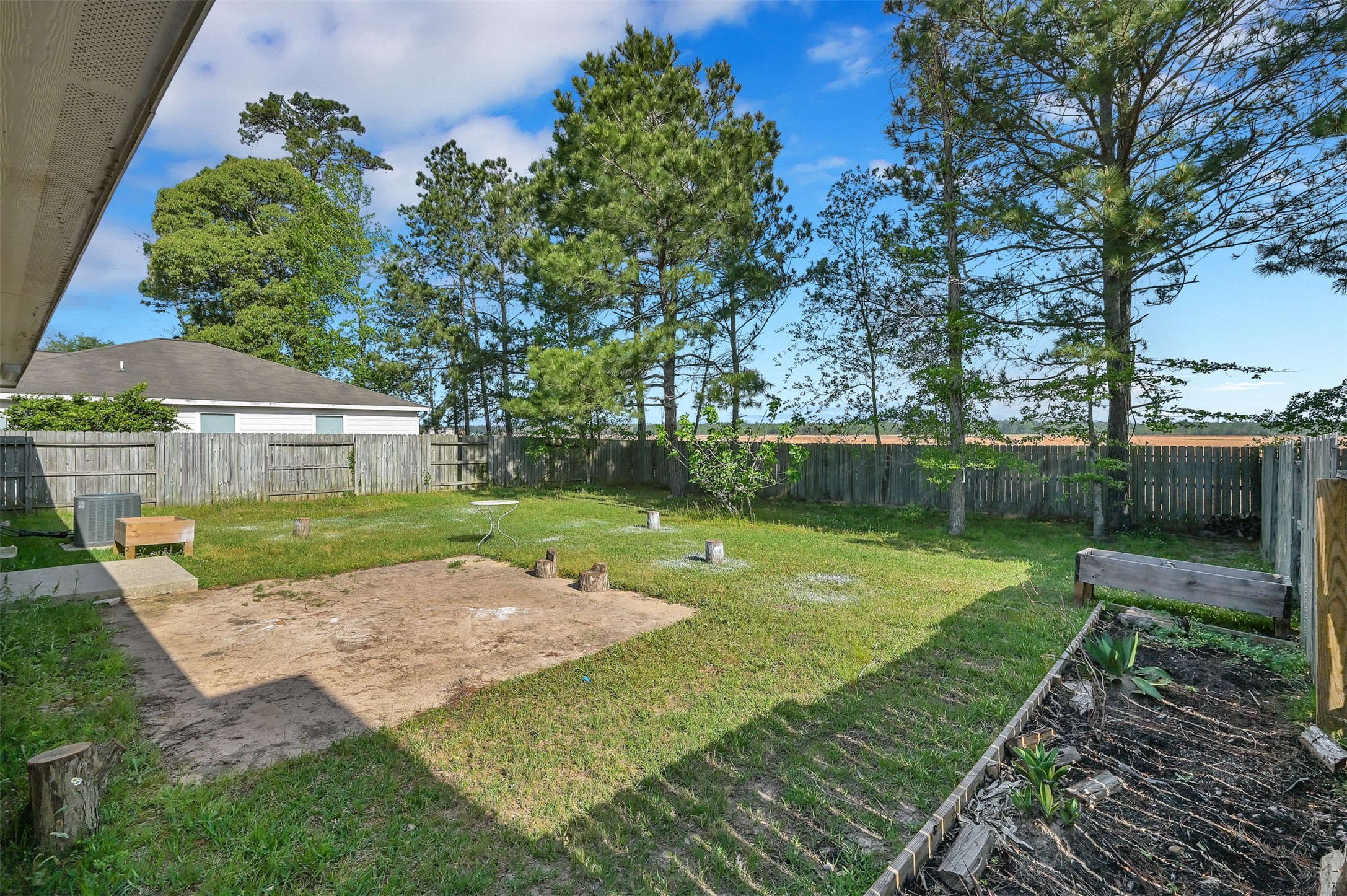 16245 Sun View Lane Conroe, TX 77302 - Photo 18 of 19 a view of a backyard with a garden