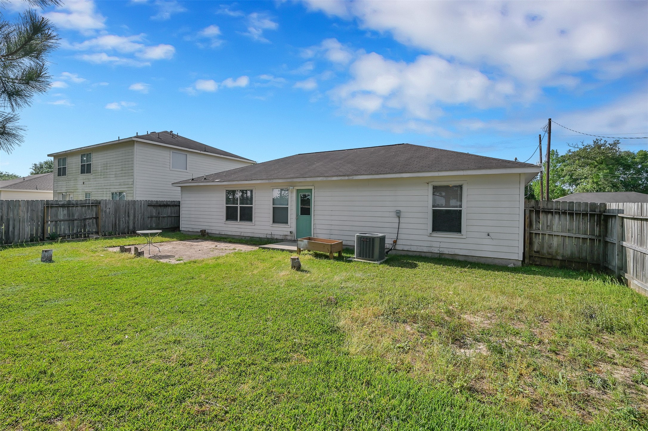 16245 Sun View Lane Conroe, TX 77302 - Photo 19 of 19 a view of a house with a backyard