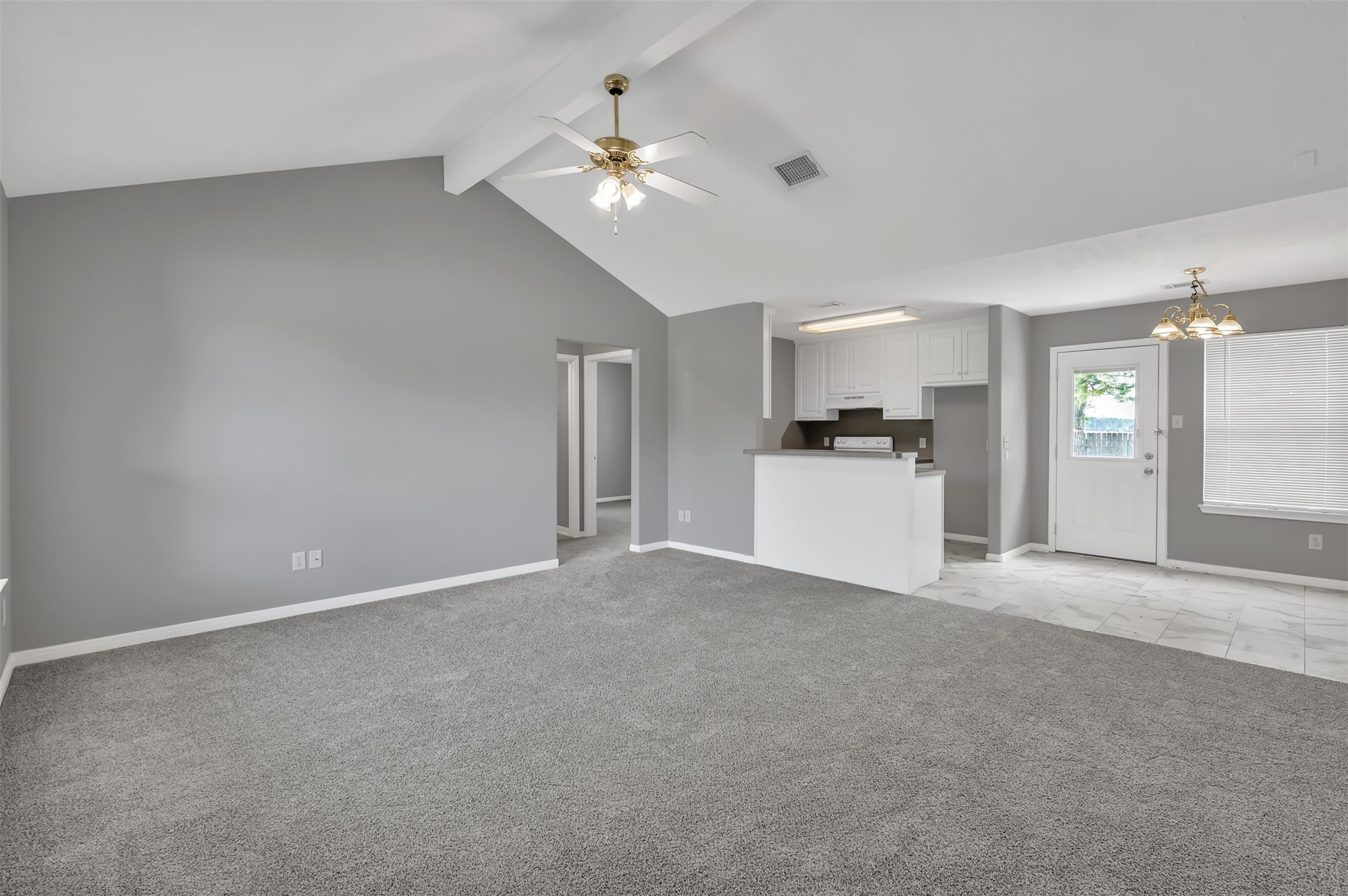 16245 Sun View Lane Conroe, TX 77302 - Photo 4 of 19 a view of a kitchen with a sink and dishwasher a kitchen island with wooden floor