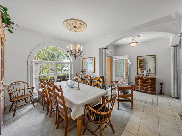 a view of a dining room with furniture window and outside view