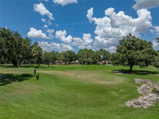 a view of a golf course with a lake view