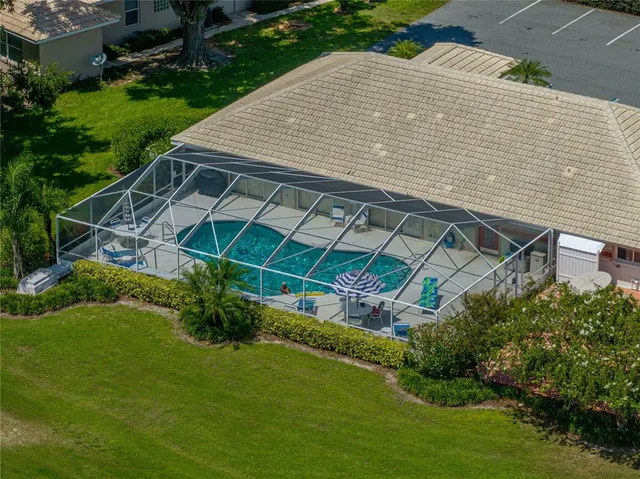 a view of a city with lots of residential buildings and mountain view in back