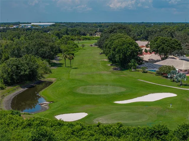 an aerial view of a house with outdoor space