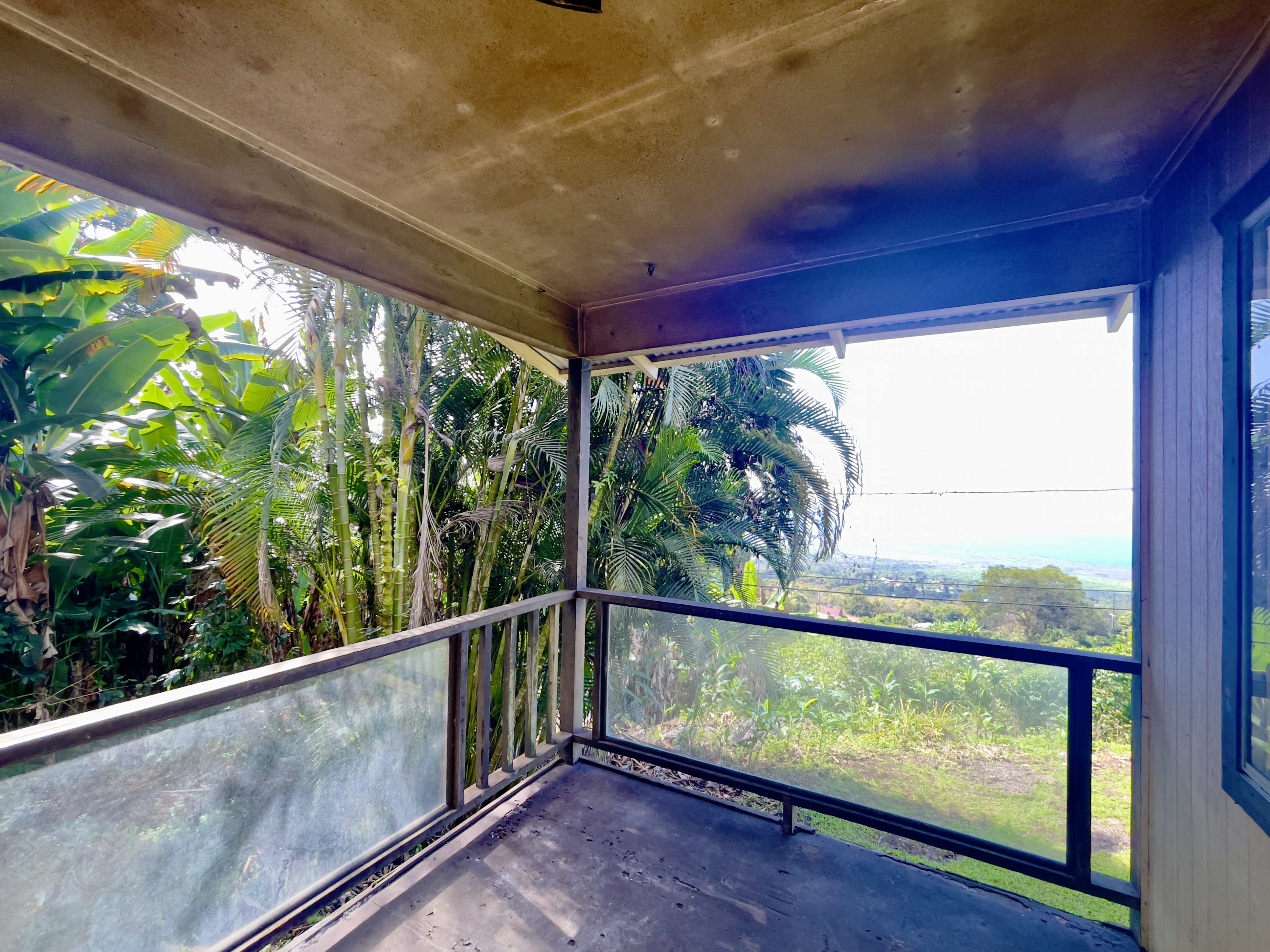 83-5586 Hawaiʻi Belt Road Captain Cook, HI 96704 - Photo 15 of 23 a view of two chairs in the balcony