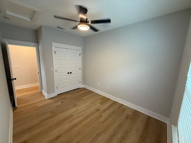 a bathroom with a granite countertop sink toilet tub and shower