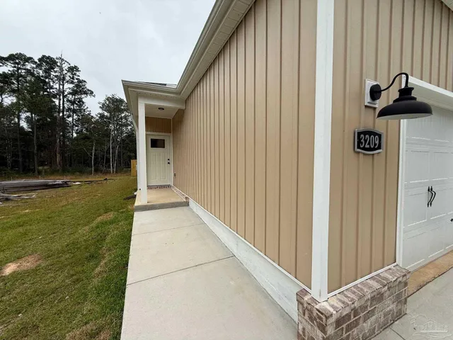 wooden floor in a hall with an empty room