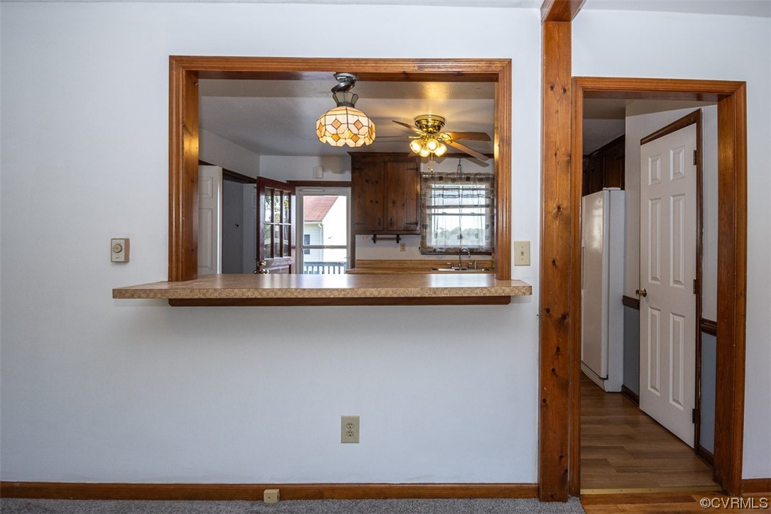 8409 Buffin Road Henrico, VA 23231 - Photo 13 of 22 a view of a hallway with wooden floors