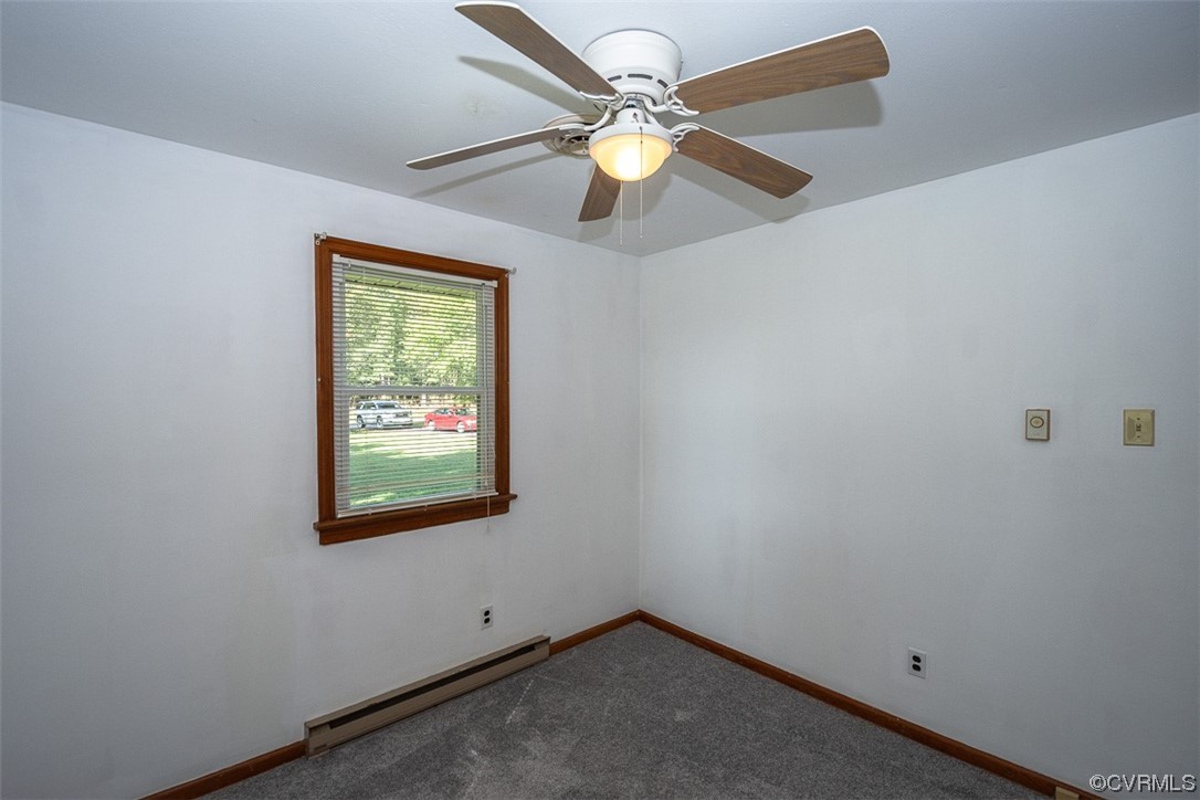 8409 Buffin Road Henrico, VA 23231 - Photo 15 of 22 an empty room with windows and fan