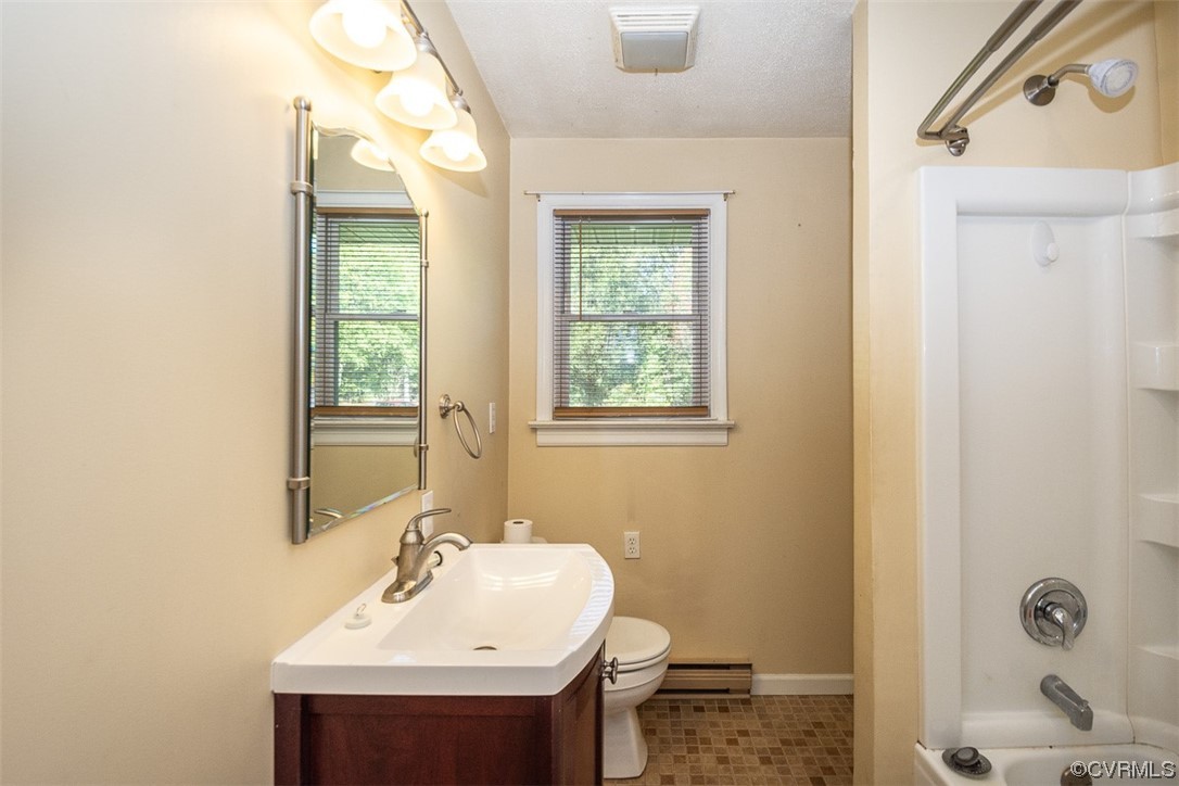 8409 Buffin Road Henrico, VA 23231 - Photo 17 of 22 a bathroom with a sink a toilet and shower