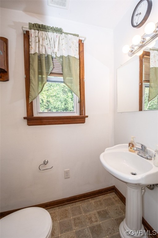 8409 Buffin Road Henrico, VA 23231 - Photo 21 of 22 a bathroom with a sink toilet and a mirror