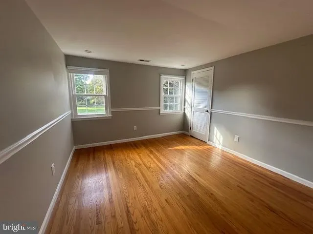 a bathroom with a bathtub and window