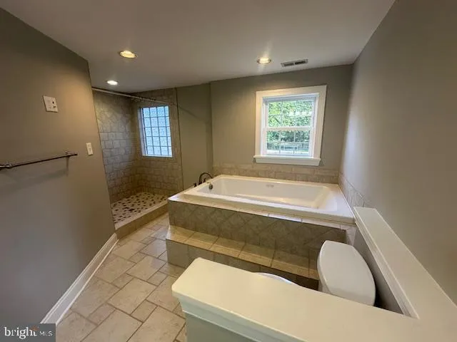 an empty room with a empty space and a window