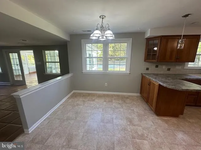 a view of an empty room with a fireplace