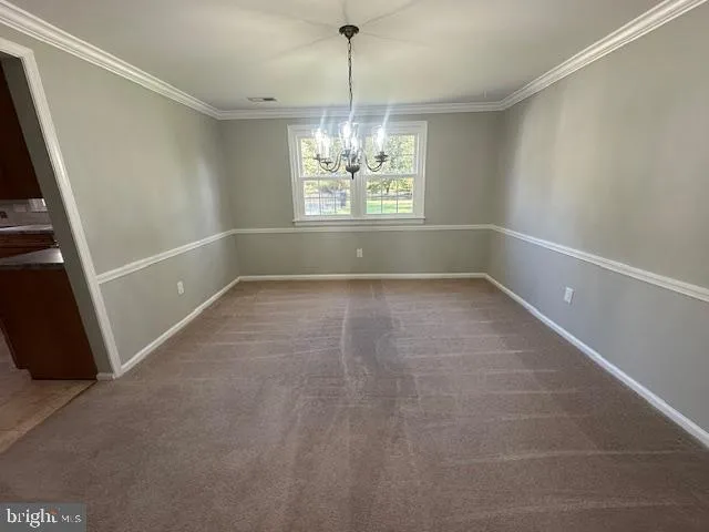 a bathroom with a sink a toilet a mirror and shower