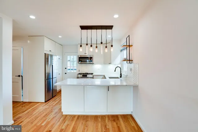a view of kitchen with wooden floor