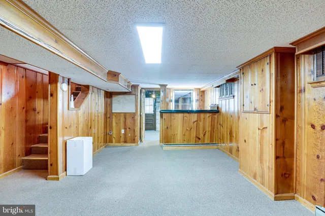 a view of entryway with wooden walls