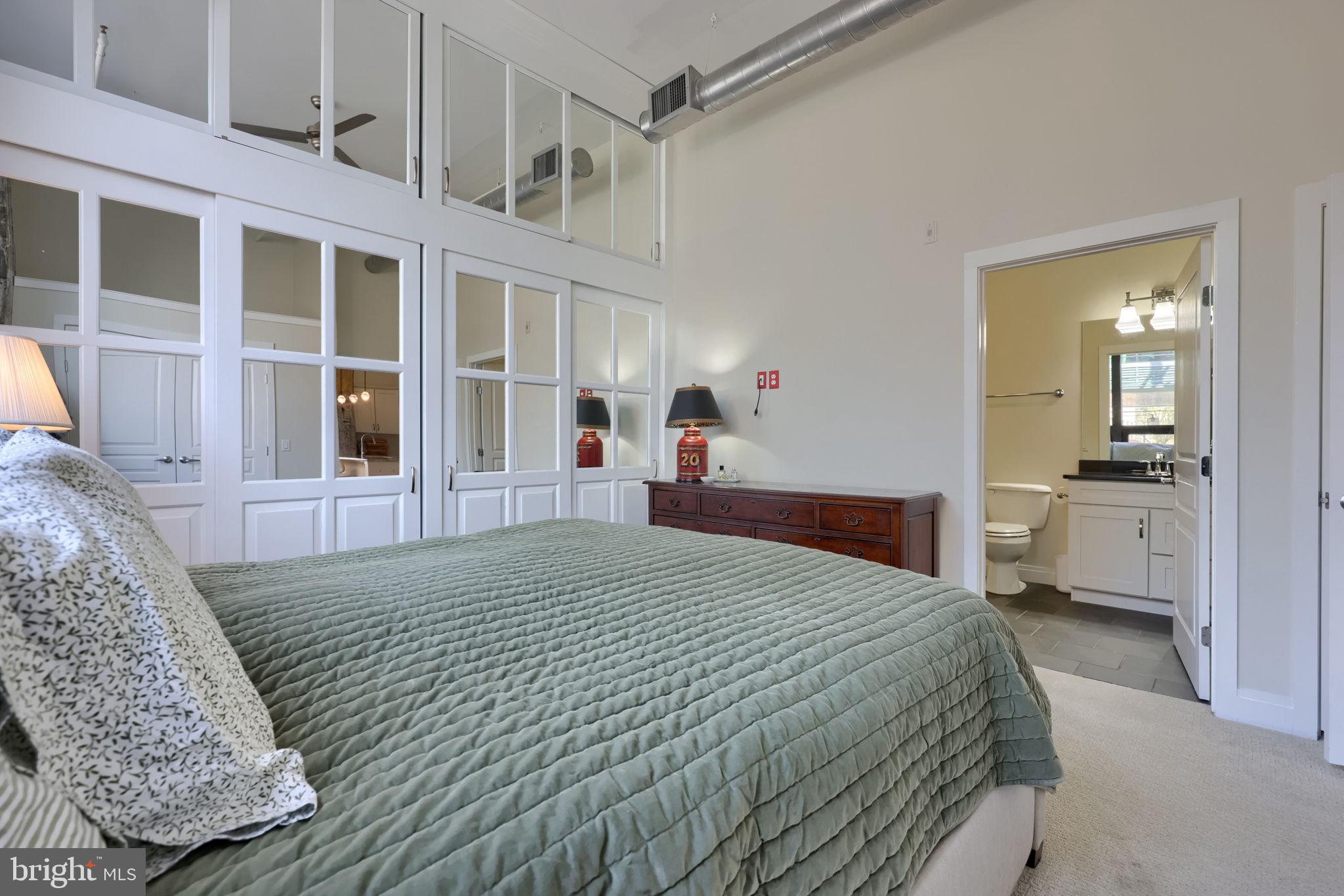 41 West Lemon Street, Unit 210 Lancaster, PA 17603 - Photo 20 of 43 a bedroom with a bed and a large window