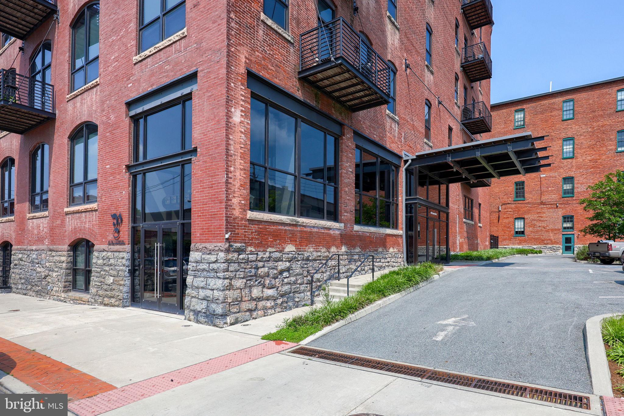 41 West Lemon Street, Unit 210 Lancaster, PA 17603 - Photo 2 of 43 a view of a brick building with many windows