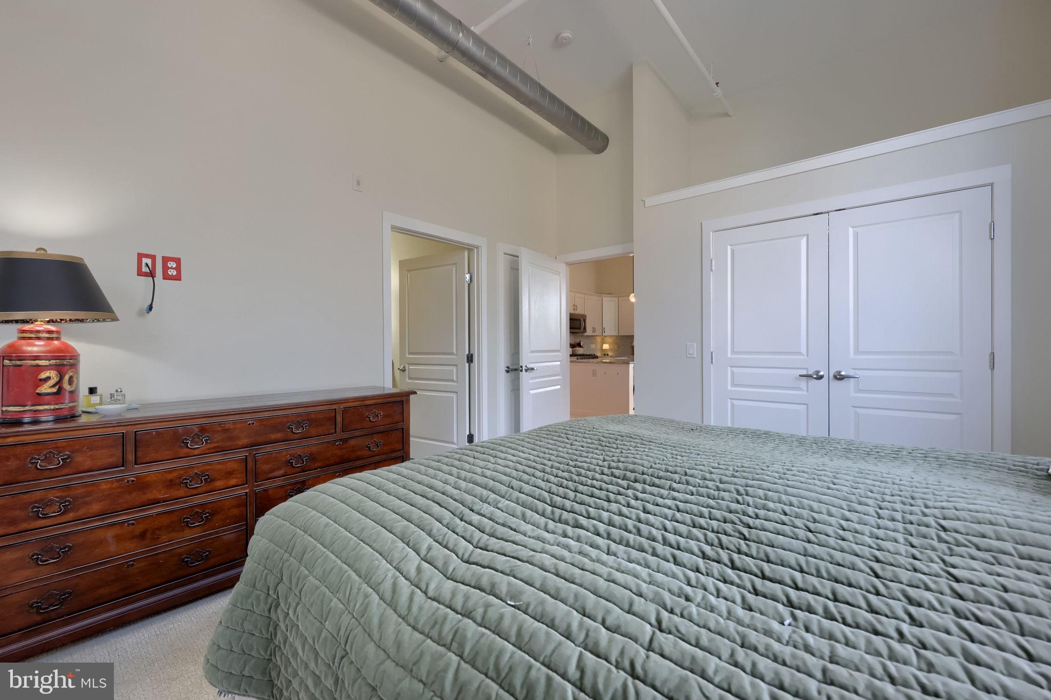 41 West Lemon Street, Unit 210 Lancaster, PA 17603 - Photo 23 of 43 a bedroom with a bed and a cabinets