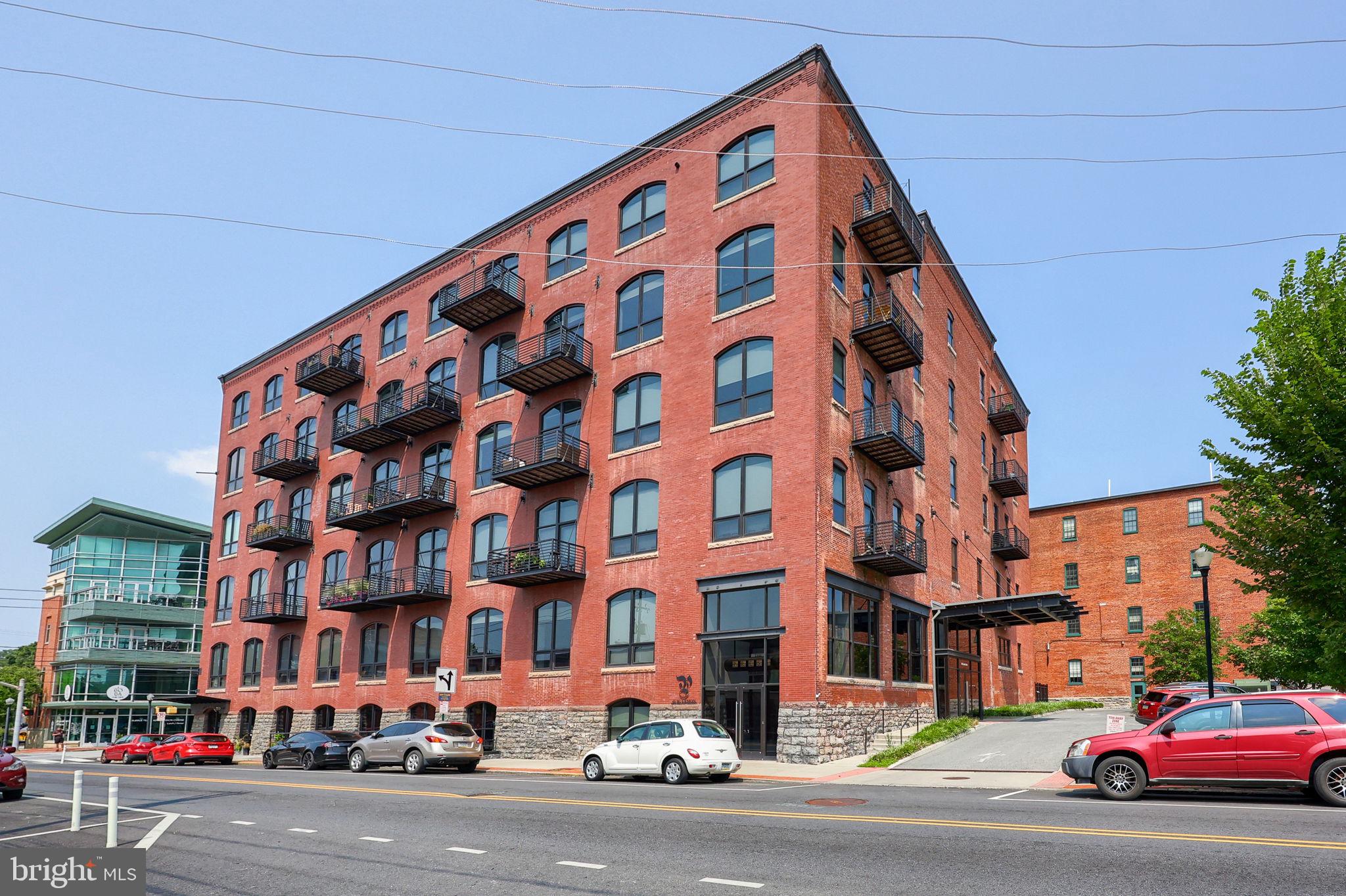 41 West Lemon Street, Unit 210 Lancaster, PA 17603 - Photo 35 of 43 a city street lined with buildings and cars