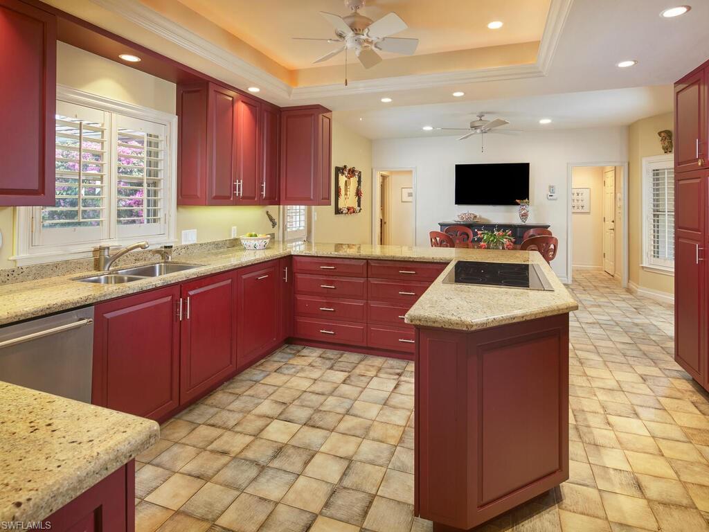 6549 Ridgewood Drive Naples, FL 34108 - Photo 4 of 4 a kitchen with a sink stove and microwave