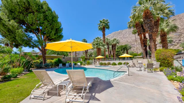 an outdoor space with patio and swimming pool