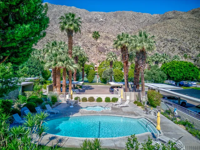 a view of a swimming pool with a patio