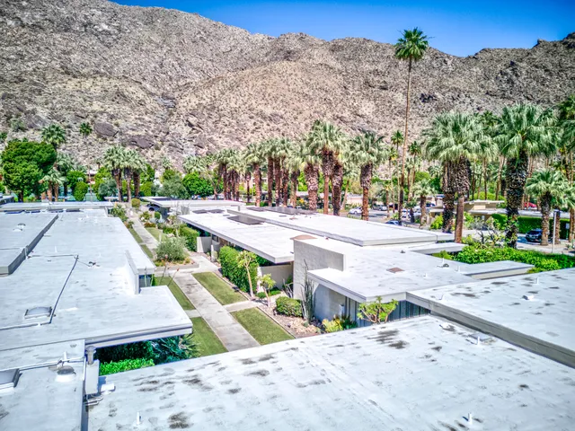 an aerial view of a house with a garden