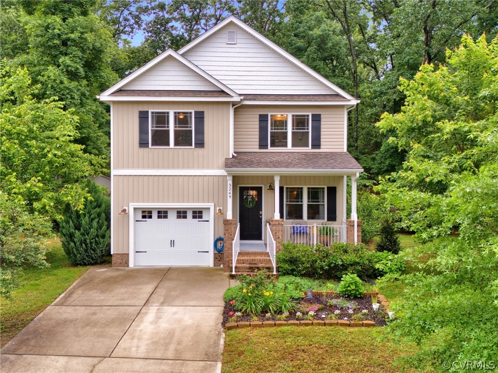 3249 Ludgate Road Chester, VA 23831 - Photo 1 of 34 a front view of a house with a garden