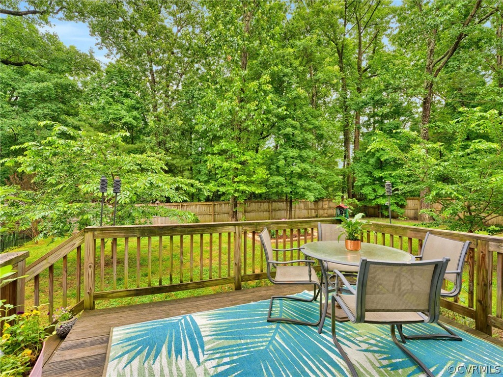 3249 Ludgate Road Chester, VA 23831 - Photo 26 of 34 a view of a chairs and table on the wooden floor