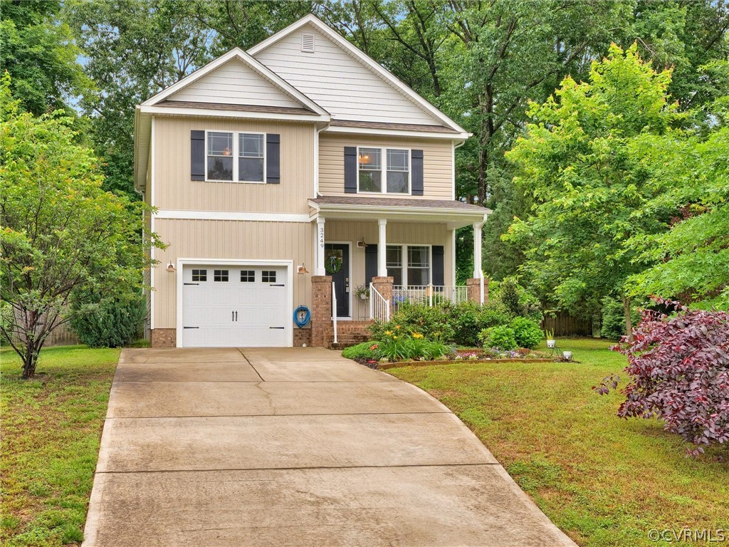 3249 Ludgate Road Chester, VA 23831 - Photo 4 of 34 a front view of a house with a yard