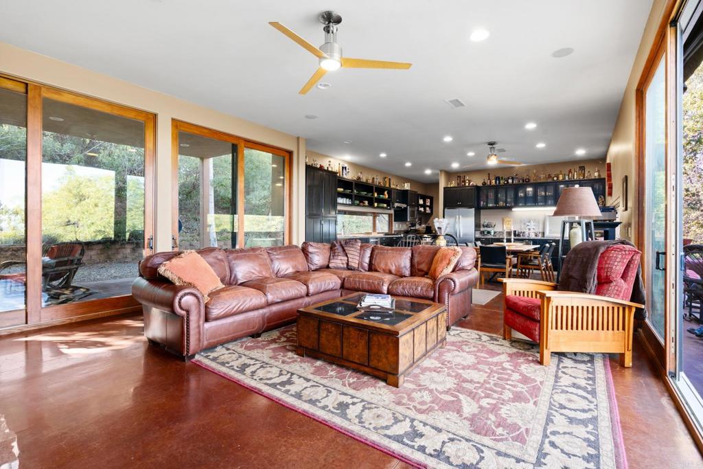 2810 3 Peaks Lane Julian, CA 92036 - Photo 11 of 54 a living room with furniture and a large window