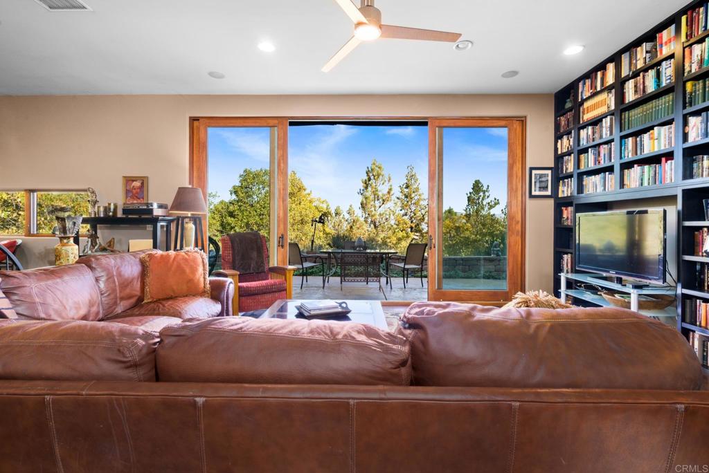 2810 3 Peaks Lane Julian, CA 92036 - Photo 12 of 54 a living room with fireplace furniture and a flat screen tv