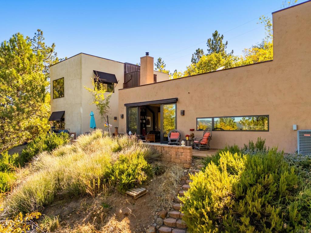 2810 3 Peaks Lane Julian, CA 92036 - Photo 16 of 54 a front view of a house with a yard