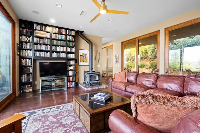 a group of dining room with furniture and wooden floor