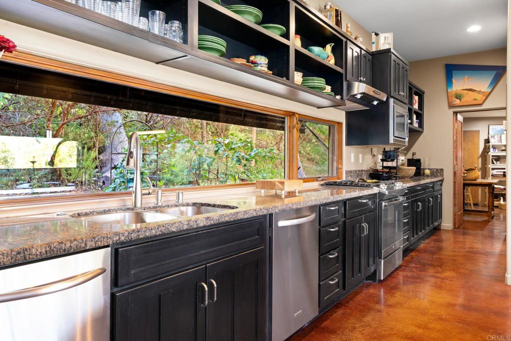 2810 3 Peaks Lane Julian, CA 92036 - Photo 22 of 54 a kitchen with stainless steel appliances granite countertop a sink and a counter