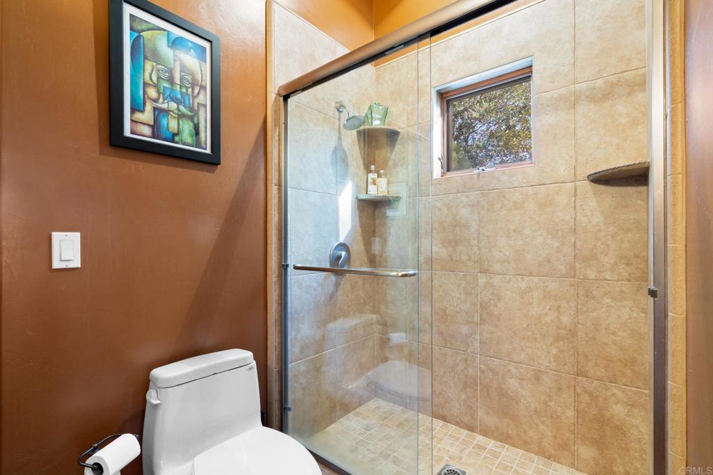 2810 3 Peaks Lane Julian, CA 92036 - Photo 29 of 54 a bathroom with a toilet sink and shower