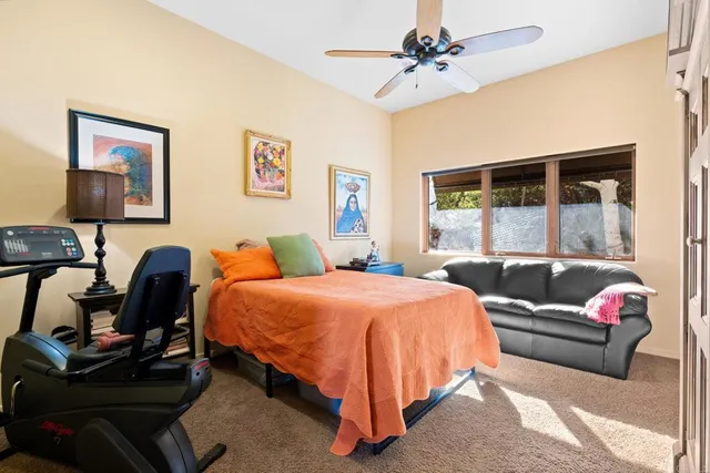 a living room with furniture and a toilet