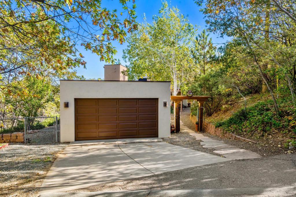 2810 3 Peaks Lane Julian, CA 92036 - Photo 45 of 54 a front view of a house with a yard and garage