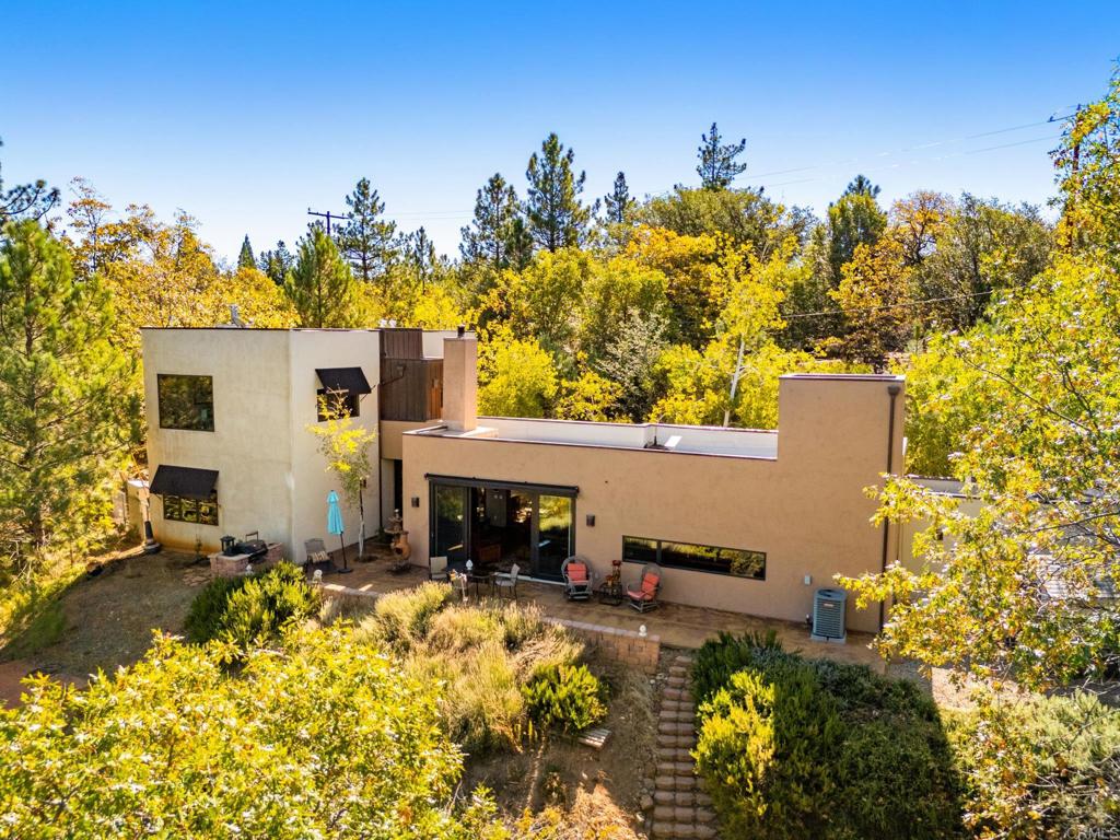 2810 3 Peaks Lane Julian, CA 92036 - Photo 51 of 54 a view of a swimming pool with potted plants and big trees