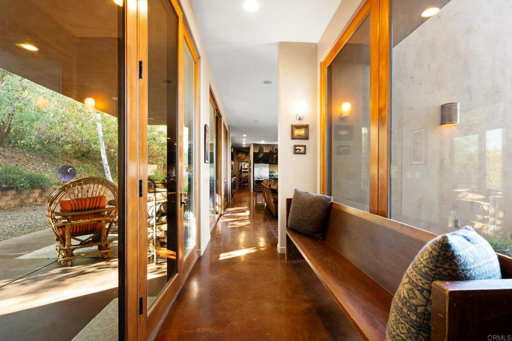 2810 3 Peaks Lane Julian, CA 92036 - Photo 10 of 54 a living room with furniture and a floor to ceiling window