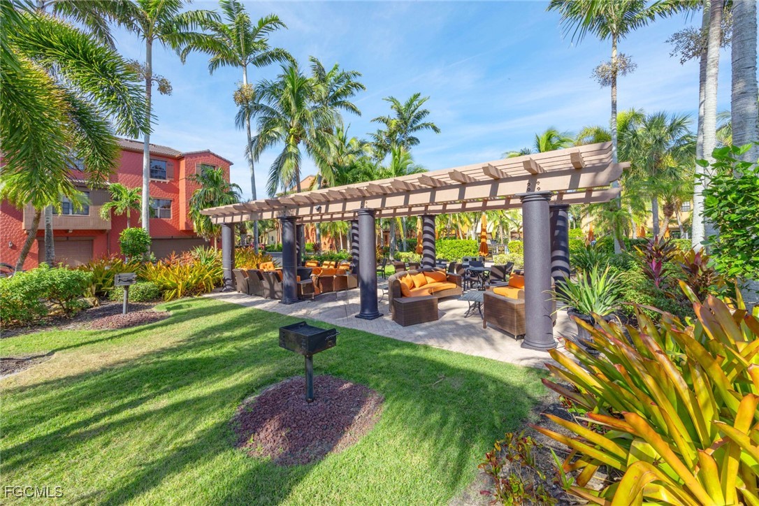 9111 Capistrano Street South, Unit 8302 Naples, FL 34113 - Photo 26 of 40 a view of yard