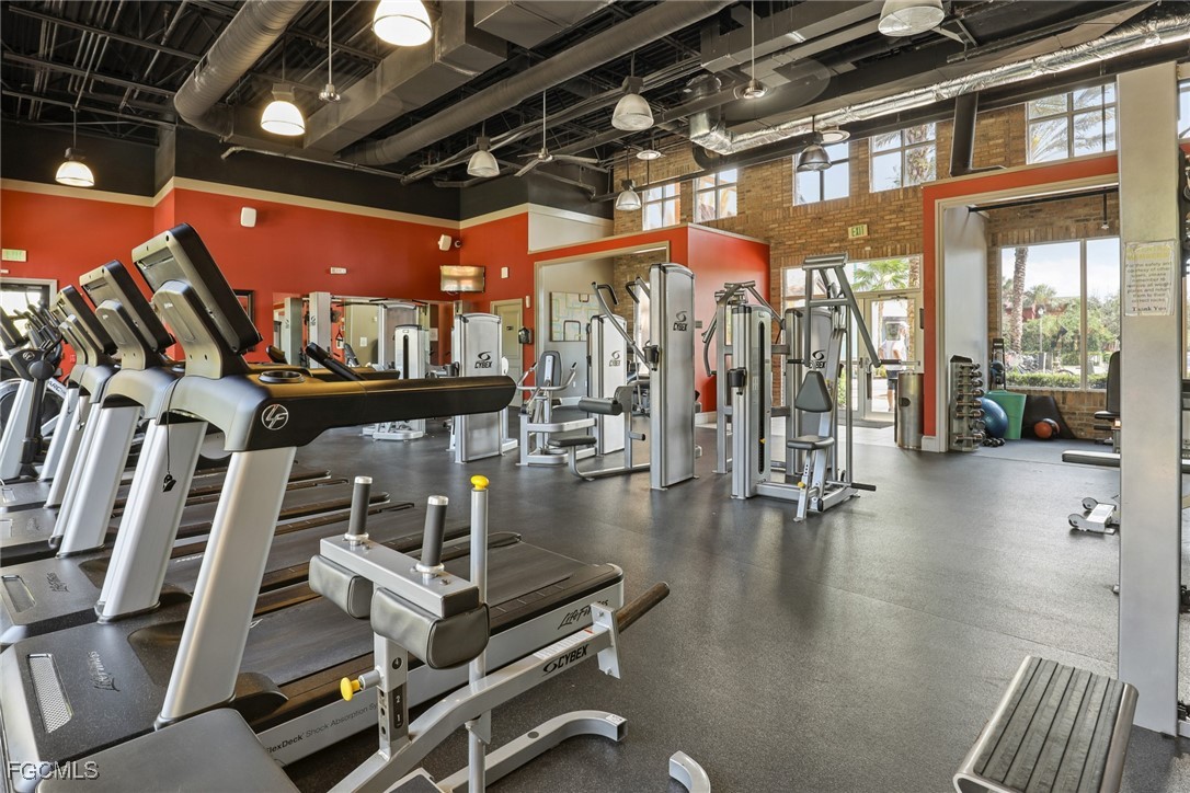 9111 Capistrano Street South, Unit 8302 Naples, FL 34113 - Photo 35 of 40 a view of a room with gym equipment