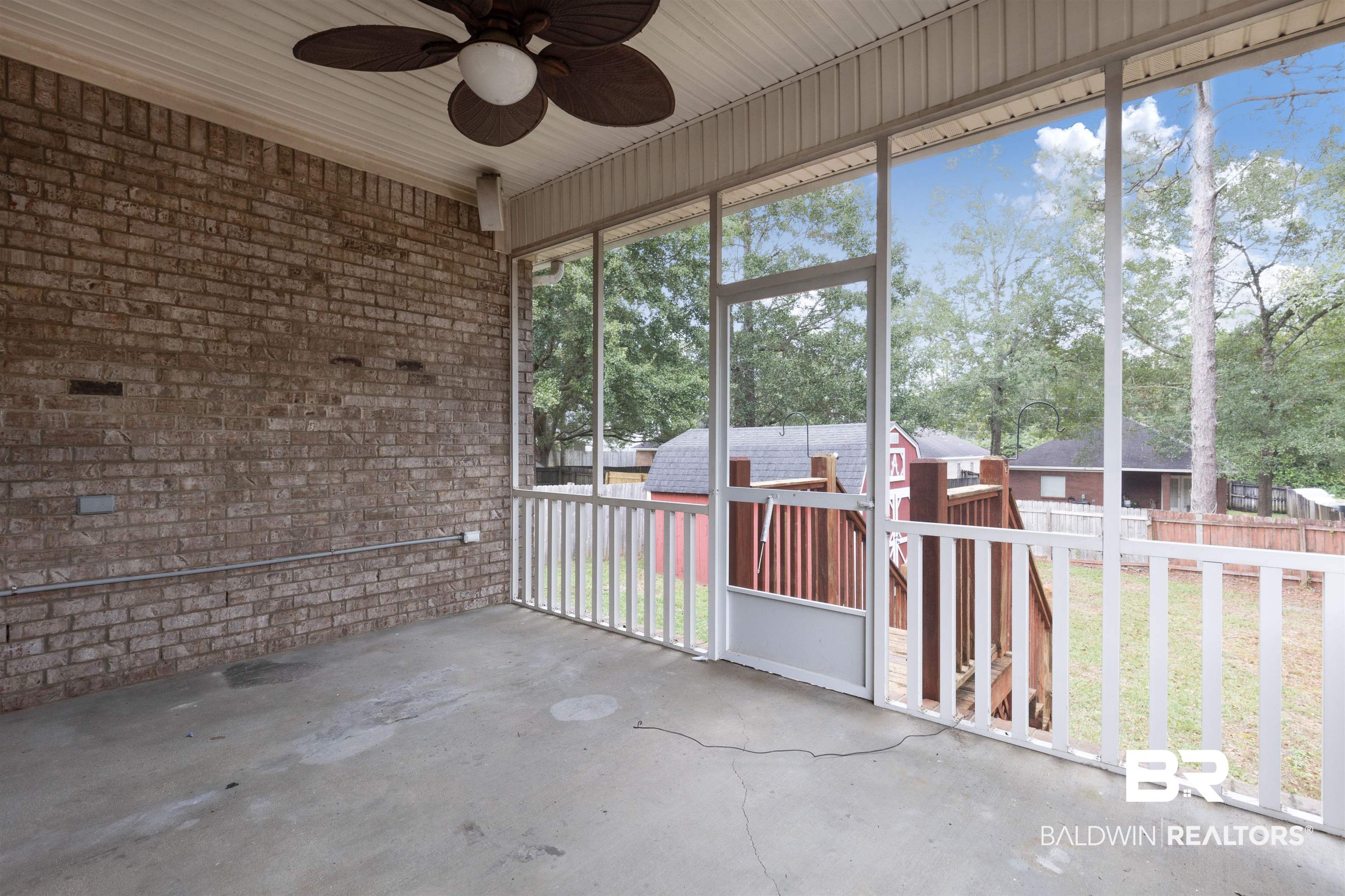 1007 Linlen Avenue Mobile, AL 36609 - Photo 18 of 21 Unfurnished sunroom featuring ceiling fan