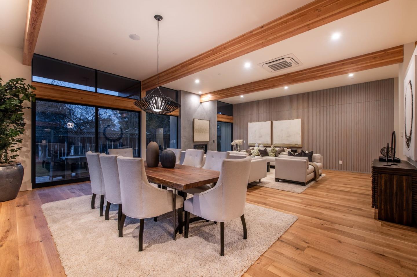 667 Springer Terrace Los Altos, CA 94024 - Photo 13 of 36 a view of a dining room with furniture wooden floor and chandelier